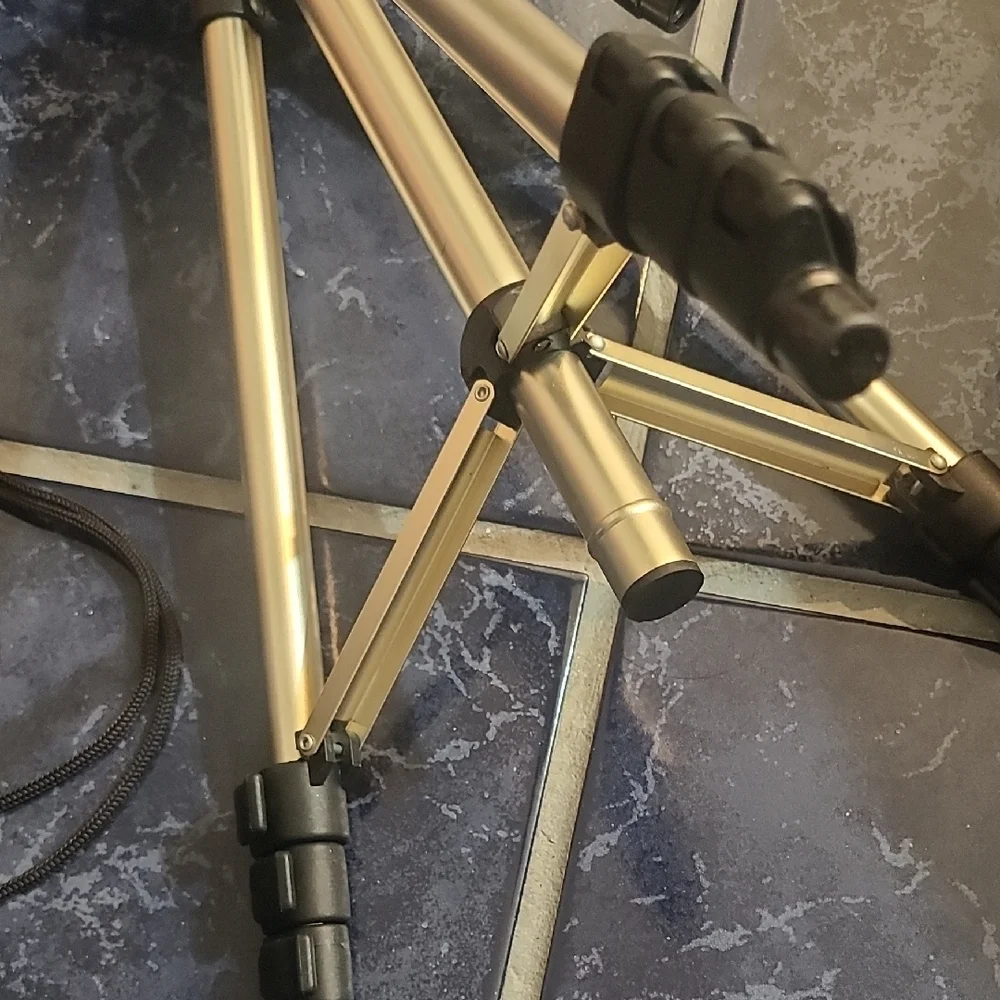 Versatile Black and Silver Camera Tripod